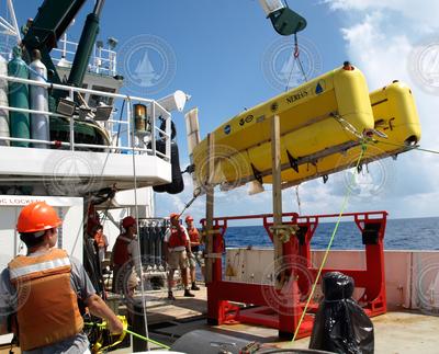 HROV Nereus suspended over the deck of R/V Cape Hatteras.