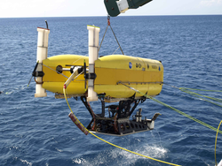 HROV Nereus in ROV mode suspended over the water surface.