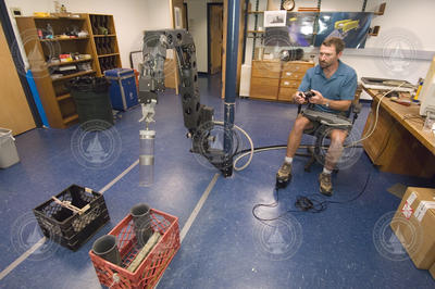 Matt Heintz testing HROV Nereus manipulator arm in lab.