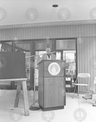Betty Bunce at the podium outside McLean lab
