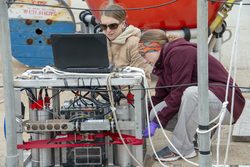 Kate Morkeski and Mallory Ringham (red) working on CHANOS II during tests.