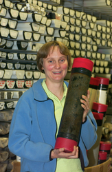 Linda Kalnejais in core lab holding a core.