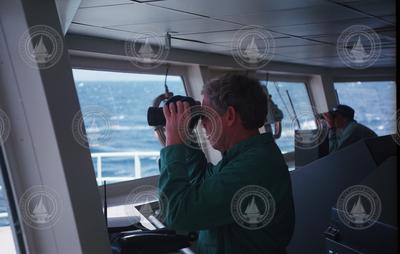 Dudley Foster on bridge with binoculars