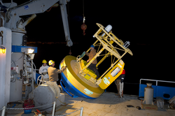 The first OOI buoy being loaded onto RV Connecticut for testing ops.