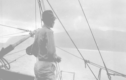 Columbus Iselin looking at shoreline of Cuba from deck of Atlantis