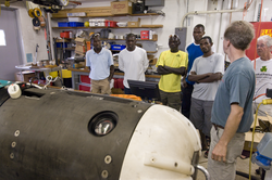 Norm Farr (right) with the Kenyan road race runners in REMUS lab.