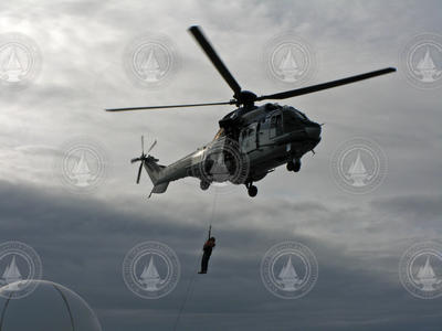 Helicopter lifting Peter Liarikos.