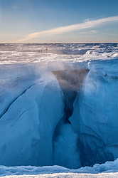 Moulin, or vertical conduit through the ice, in the Greenland ice sheet.