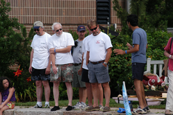 Spectators discuss strategy before the race.