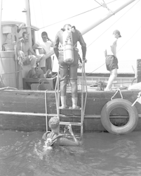 Divers climbing aboard Asterias