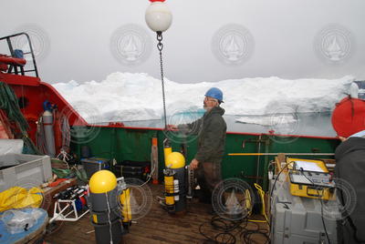 Will Ostrom deploying moored sensors in Sermilik Fjord, Greenland.