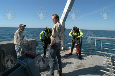 John Trowbridge, left, and Ken Houtler, right, on deck of Tioga with divers.