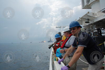 Ben Van Mooy (right) and others looking out off Endeavor in the Gulf.