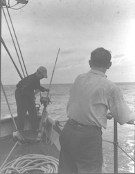 Frank Mather fishing, Harold Backus on right