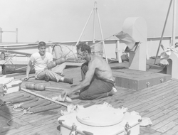 Herman Tasha (r) and George Hilton working on deck