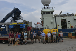 Family of NDSF vehicles and staff with R/V Atlantis at the WHOI dock.