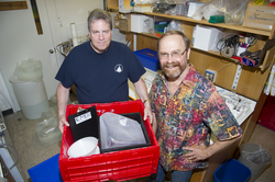 Donor Harry Hollum and Ken Buesseler with one of Buesseler's sample kits.
