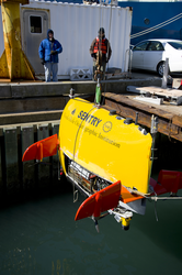 AUV Sentry is lowered into the dock well during tests.