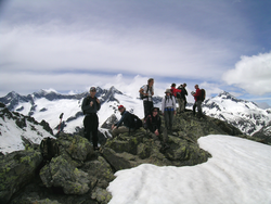 Geogynamics field trip participants on a mountain crest in the Alps.