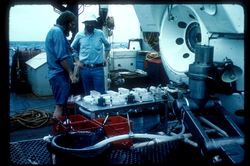 Ken Buesseler (right) and another researcher load gear onto Alvin.