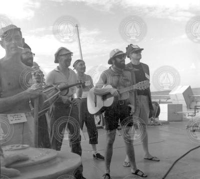 Group with musical instruments at line crossing