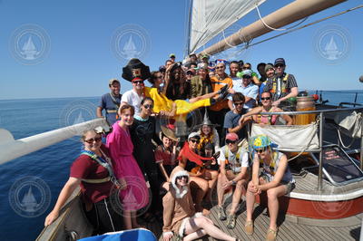 Jake Peirson Cruise participants dressed in costume on deck of the Cramer.