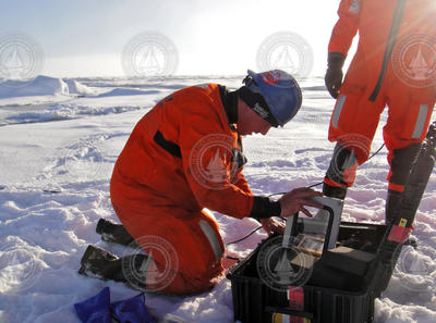 WHOI engineer Peter Koski finishes setting up a remote recording station.