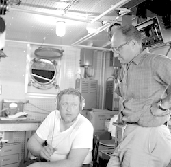 Fritz Hess and Dave Folger working below deck aboard Gosnold