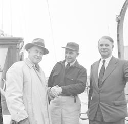 Deacon, Bray and Smith in front of Atlantis at dock.