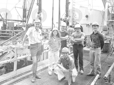 Group on deck of Glomar Challenger in hardhats.