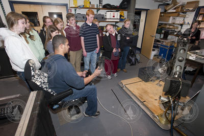 Mario Fernandez shows students how to use a manipulator arm.