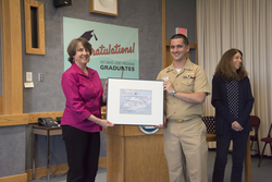 Meg Tivey presents Ryan Conway with the Pittenger fellowship award.