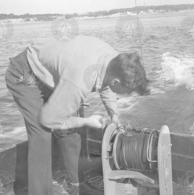 Andrew Bunker winding up spool on deck of Mytilus