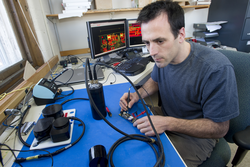 Engineer Fred Jaffre working on elephant seal sonar tag.
