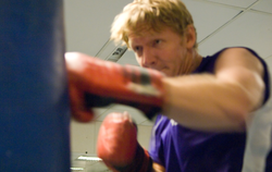 Rob Reves-Sohn working out on a punching bag.