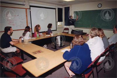 Mike Neubert illustrating his point at the chalkboard.