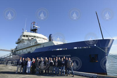 R/V Neil Armstrong officers and crew members with the ship in San Francisco.