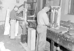 Bob Adams and Sid Peck working in the Bigelow building carpenter shop.