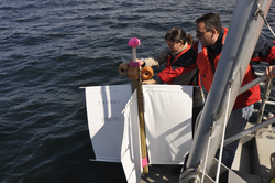 Sophia Merrifield and Dave Fratantoni launching a surface drifter.