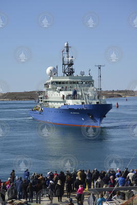 Dock full of spectators welcoming R/V Neil Armstrong to its home port of WHOI.