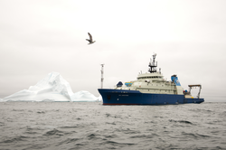R/V Neil Armstrong passing an iceberg east of Greenland.
