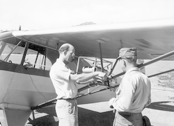 Al Woodcock attaching gear to wing strut