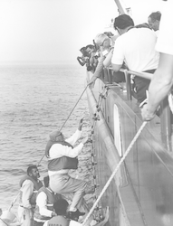 President of Finland climbing aboard the Knorr, greeted by Paul Fye.