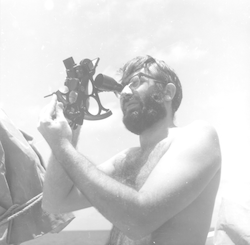 Robert Risebrough using a sextant.