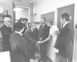 Emperor Hirohito shaking hands with Susan Garner-Price during visit.