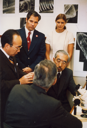 Susumo Honjo talking to sitting Emperor Hirohito during visit.