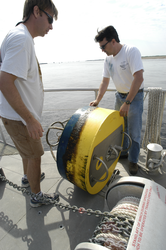 Postdoc Malcolm Scully (VIMS) and Jim Lerczak with a recovered mooring.