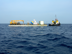 Mooring operations using a barge as the operations platform.