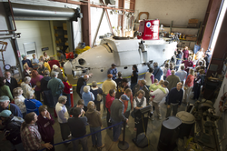 Visitors in Iselin high bay looking at DSV Alvin on display.