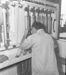 Dean Bumpus reading bottles in the top lab of Atlantis.